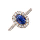 An 14ct gold sapphire and diamond cluster ring