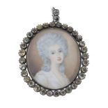 A Georgian portrait miniature pendant, depicting a lady, with paste surround