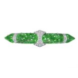 An Art Deco 18ct gold and platinum, untreated carved jade and diamond brooch