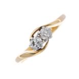 An 18ct gold and platinum diamond two-stone crossover ring