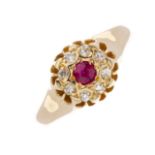 An early 20th century 18ct gold ruby and diamond cluster ring