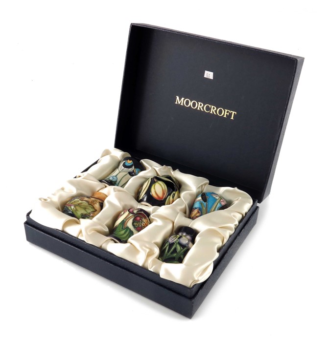 A boxed set of six Moorcroft miniature vases