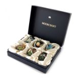 A boxed set of six Moorcroft miniature vases