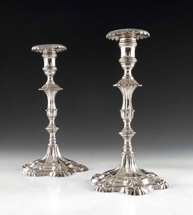 A pair of cast Continental silver candlesticks, 18th century