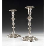 A pair of cast Continental silver candlesticks, 18th century