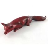 Charles Noke for Royal Doulton, a Flambe fox figure