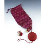 India, an antique Indian round wax seal attached to a silk bag