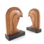 A pair of Art Deco carved wooden bookends