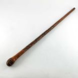 A Japanese carved bamboo cane