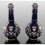 A pair of French silver and enamelled miniature vases