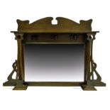 An Arts and Crafts oak and copper overmantle mirror