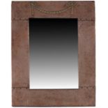 An Arts and Crafts copper and silvered brass mirror