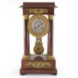 A French Charles X ormolu and flame mahogany portico clock, Empire style, signed Guyerdet