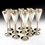 Stuart Devlin, a matched set of twelve Modernist silver and parcel gilt champagne flutes, London 197