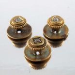 A set of three late Victorian gold and old cut diamond shirt studs