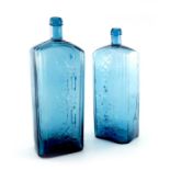 Two Imperial Russian blue glass Smirnov vodka bottles, circa 1886