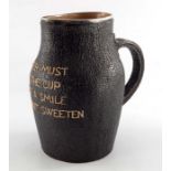 A Doulton Lambeth stoneware leather motto jug, circa 1892