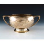 An Arts and Crafts silver twin handled bowl, Carrington and Co., London 1910