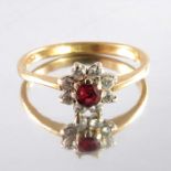 A ruby and diamond cluster ring on 18 carat gold band
