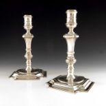A pair of Elizabeth II large cast silver candlesticks, C J Vander, Sheffield 1996