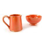 William Moorcroft, a miniature orange lustre bowl and jug