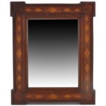 A Victorian mahogany and parquetry inlaid mirror