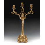 A Jugendstil gilt metal three light candelabrum