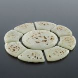 A Chinese reticulated carved jade sectional rosette