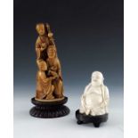 λ A 19th century carved seated ivory figure, modelled as Buddha