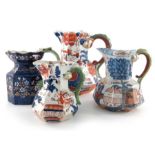 Four ironstone dragon handled jugs