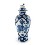 A Chinese blue and white vase and cover, Kangxi mark