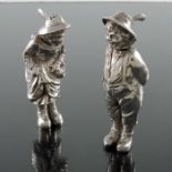 A pair of Continental cast silver novelty salt and pepper pots