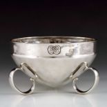 Archibald Knox for Liberty and Co., an Arts and Crafts Cymric silver bowl, Birmingham 1902