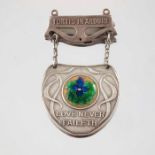 Charles Fleetwood Varley for Liberty and Co., an Arts and Crafts silver and enamelled pin badge