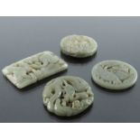 Four Chinese reticulated carved jade pendants