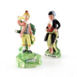 A Walton Staffordshire pearlware figure of a trumpet player and another figure of Dr Syntax