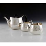 David Mellor for Walker and Hall, a Modernist silver Pride pattern three piece tea set and sugar ton