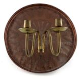 An Arts and Crafts copper and brass wall sconce