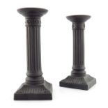 A pair of Wedgwood black basalt candlesticks, circa 1820