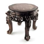 A Chinese carved hardwood and marble inset jardinière stand