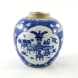 A Chinese blue and white ginger jar, Kangxi, decorated with cartouche panels containing domestic