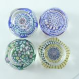 Whitefriars, four glass millefiori cane paperweights