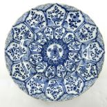 A Chinese blue and white circular charger, Kangxi, 1662-1722, decorated in the Arita manner with