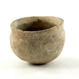 A Chinese Neolithic Quija Cord pot, of ovoid form with a flat rim opening, height 7cm