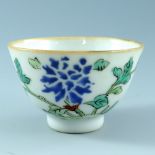 A Chinese famille vert tea bowl