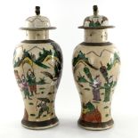 A pair of Chinese bronzed and crackle glazed temple vases and covers, early 20th Century, beast