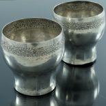 A pair of Indian white metal beakers