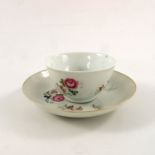 A Chinese famille rose tea bowl and saucer