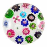 Clichy, a spaced millefiori glass cane paperweight