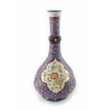 A Longwy art pottery vase, knop necked bulbous bottle form